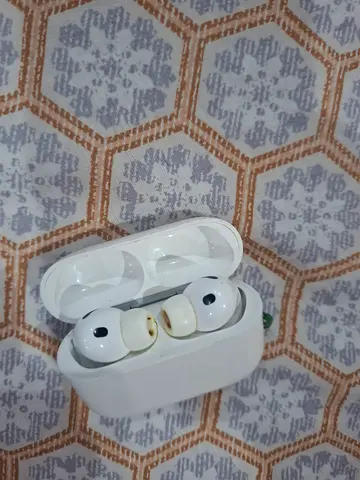Used white true wireless earbuds with charging case