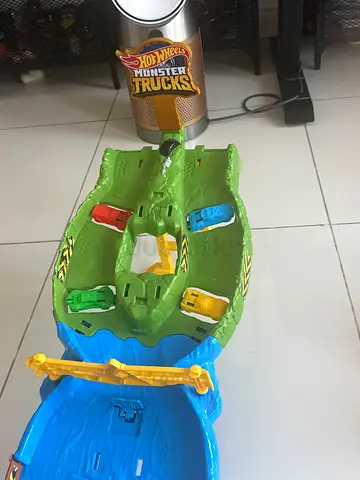 Hot Wheels Monster Trucks playset with 3 small cars