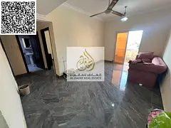 For annual rent in Al Muwaihat 3, Ajman: a one-bedroom apartment with a living room and a balcony. F