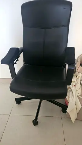 Black ergonomic office chair with armrests — good condition