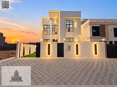 Villa for sale in Al Helio, Ajman. Features 5 master bedrooms, a majlis, a living area, and a large roof terrace. Located near Sheikh Mohammed bin Zay