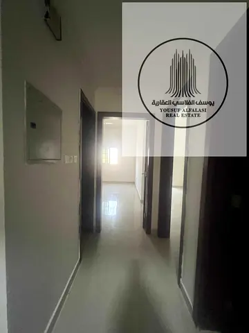 One Bedroom Hall Apartment for Rent in Al Rawda 3 Ajman Spacious Layout Balcony Separate Living Room with Door and 2 Bathrooms