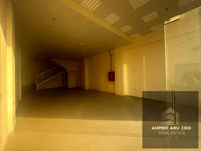 Large commercial shop with mezzanine for annual rent. Spacious, suitable for all business activities, central AC, prime location, easy loading and unl