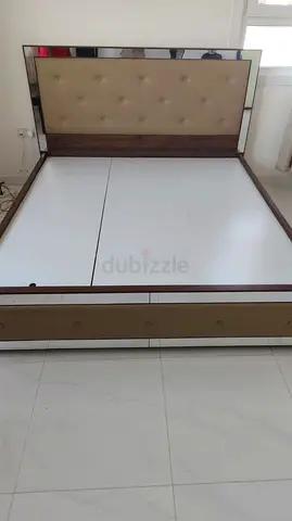 King-size upholstered bed frame with mirrored headboard