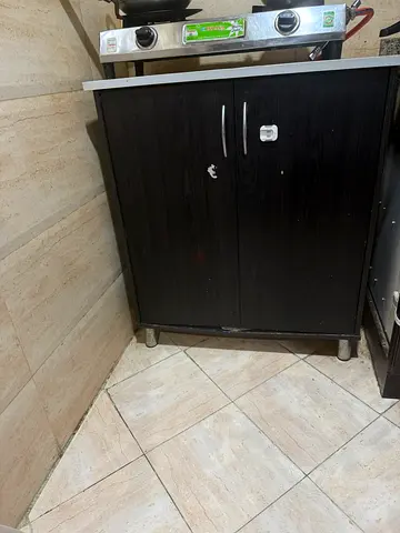 Black kitchen base cabinet with doors and countertop