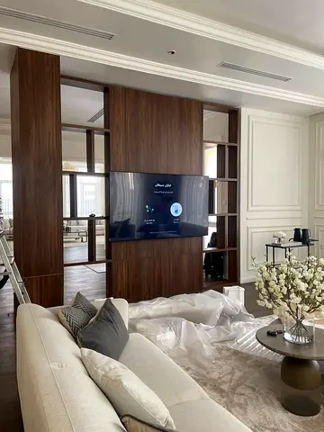 Custom walnut TV entertainment wall unit with open shelving
