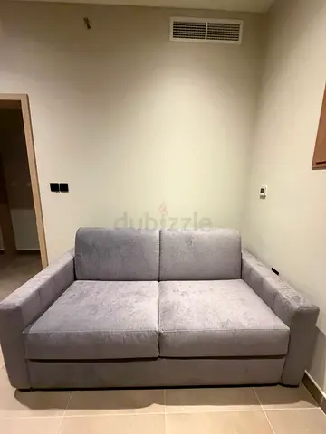 Brand new grey 2-seater fabric sofa-bed