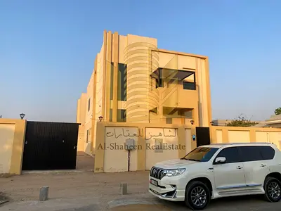 Two-story villa for rent in the Mushairef area, Ajman. Available exclusively for UAE nationals. Features: 5 master bedrooms + a master maid’s room. Includes a large kitchen, a laundry room, a formal l
