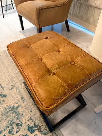 Leather tufted ottoman/stool with metal legs - used