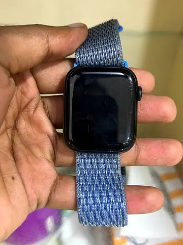 Used Apple Watch 7 with woven nylon strap charger and additional straps