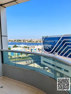 Sea View 1BHK for Rent in Orient Tower C, Ajman | Balcony & Covered Parking