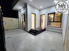 Townhouse for annual rent in Al Helw area, Ajman. Features five master bedrooms, a *majlis* (recepti
