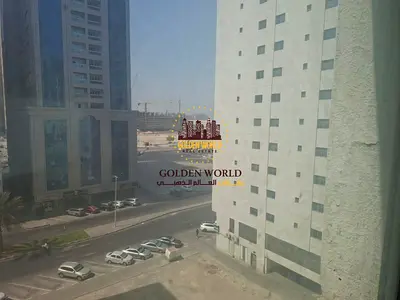 One-bedroom apartment with a living room for rent in Al Majaz 2, Sharjah. The apartment features a