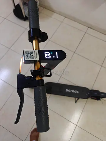 Porodco electric scooter,wed charger,,Rang 15km location sharjah leborttry signal