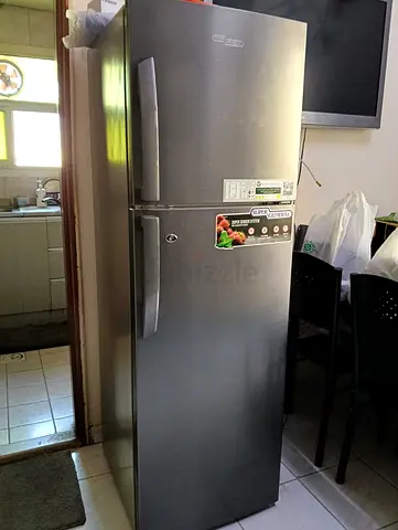 Silver double-door refrigerator - good working condition