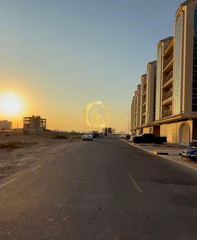 For sale: commercial land in Muweileh Commercial, third plot from the street, adjacent. Area: 2900 sq ft. Land +3 permit.