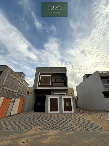 Villa for sale in Al Zahia, Ajman. Features 4 master bedrooms, a majlis, and a living room. Available for freehold ownership by all nationalities.