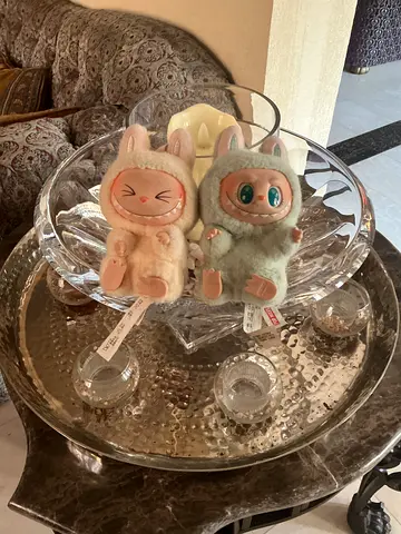 Pair of plush collectible bunny dolls — gently used