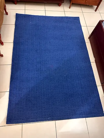 Plain blue area rug in good used condition