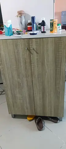 Small two-door wooden storage cabinet - good condition