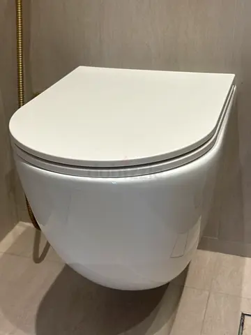Modern wall-mounted smart toilet/bidet (good condition). New in box. Bagno Design. Aqua Eco