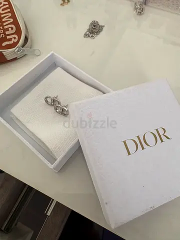 Authentic Dior silver-tone logo ring in box