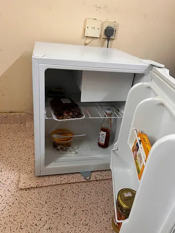 Compact mini fridge - works well, good for bedroom or office