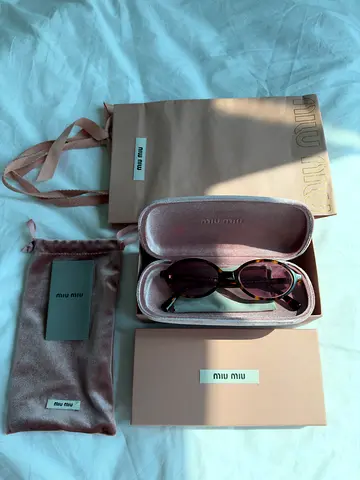 Miu Miu oval sunglasses, authentic (have a check)