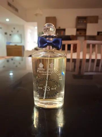 Penhaligon's Blenheim Bouquet-style cologne bottle with navy bow (partially used)