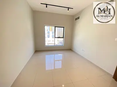 Two-bedroom apartment with a living room, three bathrooms, a balcony, and built-in wall closets. Lo