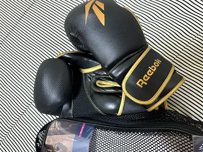 Reebok black & gold boxing gloves - lightly used