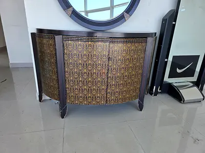 Decorative Half-Moon Console Cabinet with Ornate Gold Pattern along to vintage round shape mirror