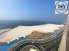 Enjoy a stylish three-bedroom apartment with a living area and a direct sea view on the Corniche—t