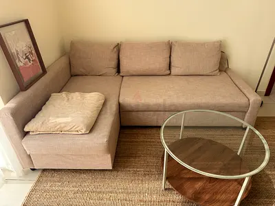 Beige L-shaped IKEA Sofa bad with storage