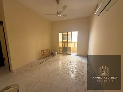 1BR apartment with bath and balcony for annual rent in Al Rawda 1 Ajman opposite Kenz Mall, for 26k in 4 or 6 payments with check deposit, prime locat