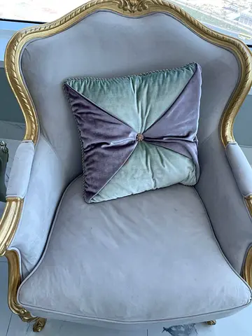 Elegant vintage-style upholstered armchair with gold trim