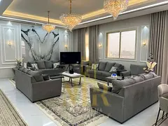 Fully furnished villa in Al Alia, Ajman, with an internal yard. Includes water, electricity, central