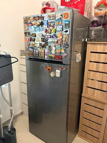 Silver double-door refrigerator in good working condition