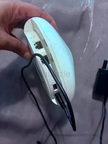 Used Apple router white) - wired charging cable included