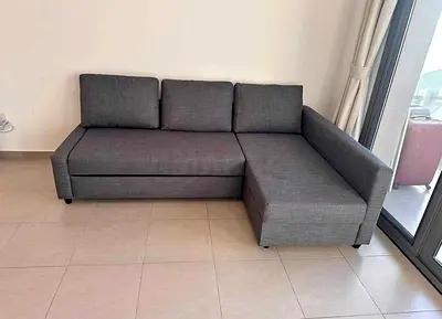 L-shaped grey fabric sofa with storage - good condition