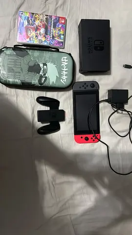 Nintendo switch used good condtion with games and charger and an sd card with extra storage