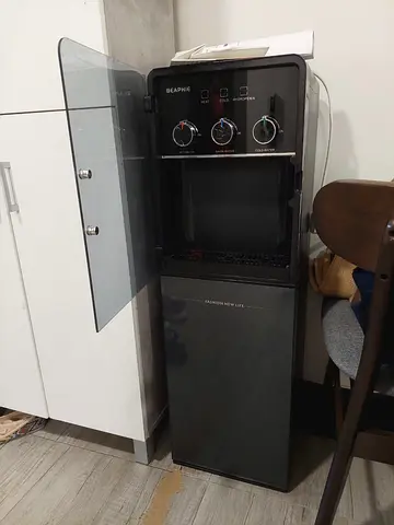 Standing Water Dispenser with Bottom Storage — Black, Good Condition