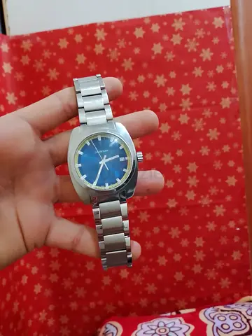 Vintage stainless steel men's wristwatch with blue dial