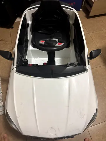 White electric ride-on toy car for kids — single seat, steering wheel