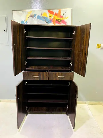Dark Wood Tall Storage Cabinet with Multiple Shelves and Drawers