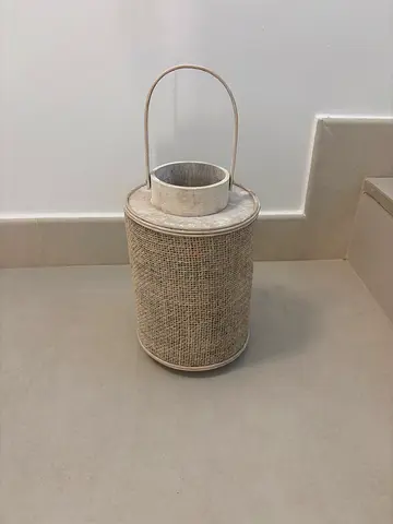 Decorative wicker-style candle lantern with handle — neutral finish