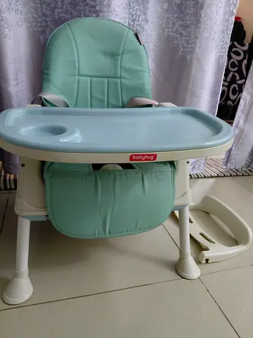 Light green baby high chair with removable tray - good condition