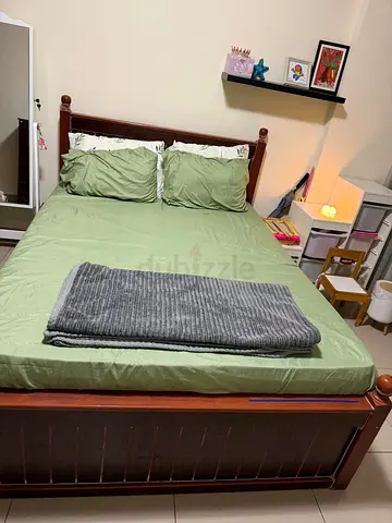 Wooden Bed and coat