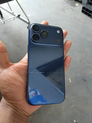 Used blue iPhone (rear glass cracked) - 3 camera model