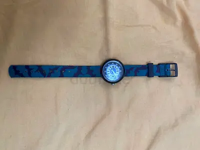 Flik Flak boys' Batman analogue watch with blue camo fabric strap